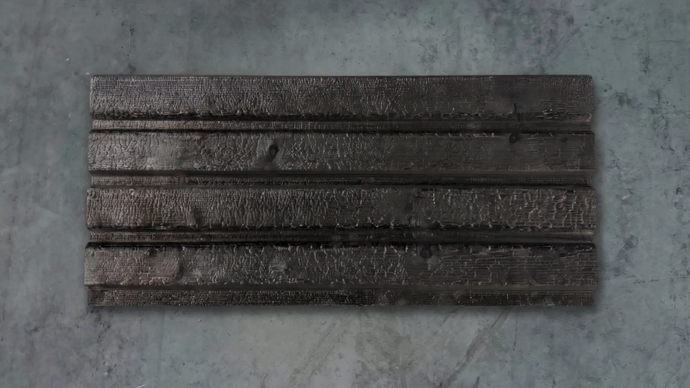 Charred Yakisugi cladding boards on a concrete floor